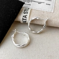 French minimalist silver matte twisted hoop earrings on soft linen background display - Matte Twist Earrings (A-158)