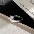 Close-up of silver bypass ring with baguette cubic zirconia and white shell inlay - Silver Shell Ring / Silver