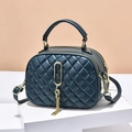 Deep teal quilted crossbody bag with dual zippers, gold hardware and tassel detail - Teal