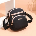Lightweight black oxford fabric crossbody bag with pink stitching and gold heart zippers - Black Patchwork Style