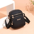 Black lightweight nylon crossbody bag with gold heart zippers and adjustable strap - Solid Black