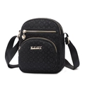 Lightweight black nylon crossbody bag with heart pendant and monogram pattern - Black Patterned