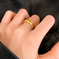 Chic gold croissant dome ring featuring a twisted rope design worn on a finger - Twisted Rope Style (C-418)