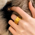 Close-up of a wide gold ring with matte brushed finish and irregular wavy edges - Wavy Irregular Edge Brushed Style (C-182) / Gold