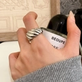 Close-up of minimalist croissant dome ring in S925 silver worn on model's hand - Croissant Style (C-26) / Silver