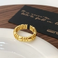 Detailed close-up of a gold adjustable open ring featuring a segmented geometric design - Gold Flat Tail Open Ring