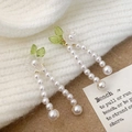 Detail of drop earrings with white acrylic petals, green leaves, and pearl chains - A-1508 Pearl Tassel Drop Earrings