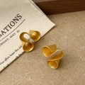 Detailed macro view of spiral ribbon earrings with a textured matte gold finish - Spiral Ribbon Curl Style (A-1369)