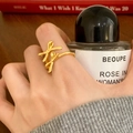 Elegant gold double bow open ring for women with polished finish on a finger - Double Bow Knot Style (C-420) / Gold