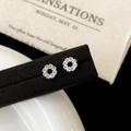 Close-up of silver wreath stud earrings with pavé-set zircons on an elegant display - Silver Circle Style (A-1198)