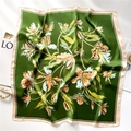 Detail of 70cm square silk scarf featuring floral lily prints and emerald green borders - 70x70cm / Forest Green Floral (FJ682-1)
