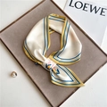 Detail of a chic cream silk-feel scarf with tulip print and contrast stripe borders - 76x13cm / Tulip Beige