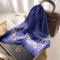Elegant navy blue silk scarf with rose print and grid pattern draped on a handbag - 70x70cm / Navy Blue