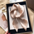 Close-up of a pink silk scarf with geometric diamond pattern in a black gift box - 70x70cm / Khaki