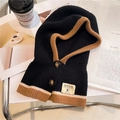 Detail of knitted balaclava with caramel contrast edge and wooden button closure - Black and Caramel