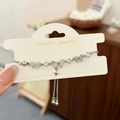 Kattenoog steen strik armband met zirkonia en ster hanger in zilveren afwerking - Strik (D-360) / Zilver