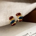 Macro view of burgundy and navy enamel stud earrings with gold-tone metal base detail - Triple Oval Bean Stack Style (A-1044)