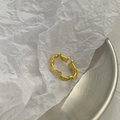 Detail of gold double-layer wavy ring with textured surface on a silver tray - Adjustable Open / Matte Gold Wave Ring