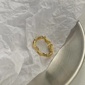 Close-up of golden double-layered twisted rope ring with textured wave design - Adjustable Open / Bright Gold Wave Ring