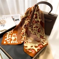 Elegant silk scarf with leopard and geometric print draped over a brown leather handbag - Brown Pink Leopard Patchwork (FJ520-4)
