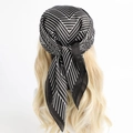 Striped black and white silk-like square scarf tied as a trendy headband on a model - Black and White Stripe Style (FJ599-1)