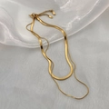 Close-up of a double-layered gold snake chain necklace with an adjustable extender chain - Gold Double Layered Necklace