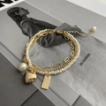 Detail of layered gold bracelet with pearls, heart pendant and adjustable extension chain - Heart Three-layer Bracelet (Gold Plated)