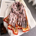Detailed close-up of a pink floral cotton linen scarf with geometric patterns and feathers - Pink Feather Floral Style (YM237-2)