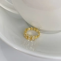 Detailed close-up of a gold leaf ring with sparkling marquise-cut zircon stones - Adjustable Open / Gold
