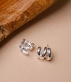 Close-up of silver triple-hoop stud earrings with a polished finish and minimalist C-shape - Silver