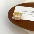 Macro detail of gold-plated wide ring with white enamel inlay and wavy edge - White Enamel Ring