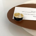 Detailed view of wide gold-plated ring with black enamel wavy edges and retro texture - Black Enamel Ring