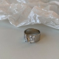 Detail of silver-plated open ring with cluster of rectangular and round cubic zirconia stones - Silver