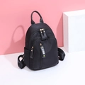 Mini mochila negra de nailon impermeable con cremalleras metálicas y detalle de cinta FIDM - Pequeño / Negro