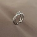 Macro detail of criss-cross ring showing pavé-set stones and polished silver finish - Criss-Cross Twisted Micro-Pave Style / Silver