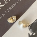 Detail of minimalist bean stud earrings showing brushed silver texture and polished inner - Silver Brushed Bean Curved Stud Earrings