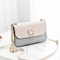 Summer chain crossbody bag with sequined silver panel and pearl cat charm detail - Off White