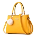 Elegante bolso de mano trapezoidal amarillo brillante con pompón y correa ajustable - Amarillo Limón