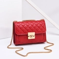 Chic red quilted leather crossbody bag with elegant gold chain strap and metal turn-lock - Red
