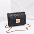 Classic black quilted crossbody bag with gold chain strap and metal turn-lock closure - Black