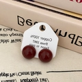 Close-up of wine red enamel copper ball stud earrings on display card background - Wine Red (A-768)