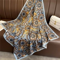 European vintage floral print silk scarf 90x90cm draped on a leather sofa - Grey Blue Baroque Floral (FN82-4)