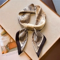 Champagne paisley square silk scarf folded into a bow on a luxury gold tray display - Champagne Base with Dark Brown Paisley (FJ561-4)
