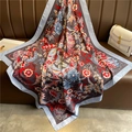 Retro floral print silk square scarf in blue and grey, draped over a brown leather couch - Blue Grey Vintage Floral Style (FN77-1) / 90x90cm