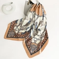 Equestrian chain print satin square scarf in caramel tied to a grey handbag - Caramel Rice White Equestrian Chain (FT229-1T)
