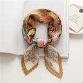 Elegant pleated floral silk scarf in yellow and pink hues on a white book base - Ginger Yellow Floral (FY96-2)