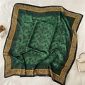 Close-up of emerald green silk scarf featuring leopard print borders and floral patterns - Caramel Leopard Chain Style (FM288-2)