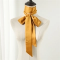 Detail of a golden mustard satin skinny scarf tied in an elegant bow on a mannequin - Golden Yellow (LJ16-73) / 190*5cm