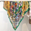 Close-up of a vibrant 110cm silk-like scarf with abstract graffiti patterns on a metal rack - Multicolor Abstract Graffiti Collage (FE148-2)