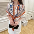 Detailed macro view of baroque patterns on a luxury orange and navy silk scarf - Hermès Orange Equestrian Chain (FE44-1)